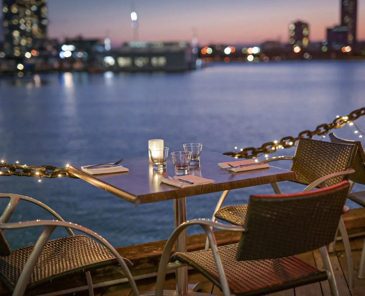 Glass Dining & Lounge Bar, Gold Coast waterfront dining, candlelit table with city lights in background