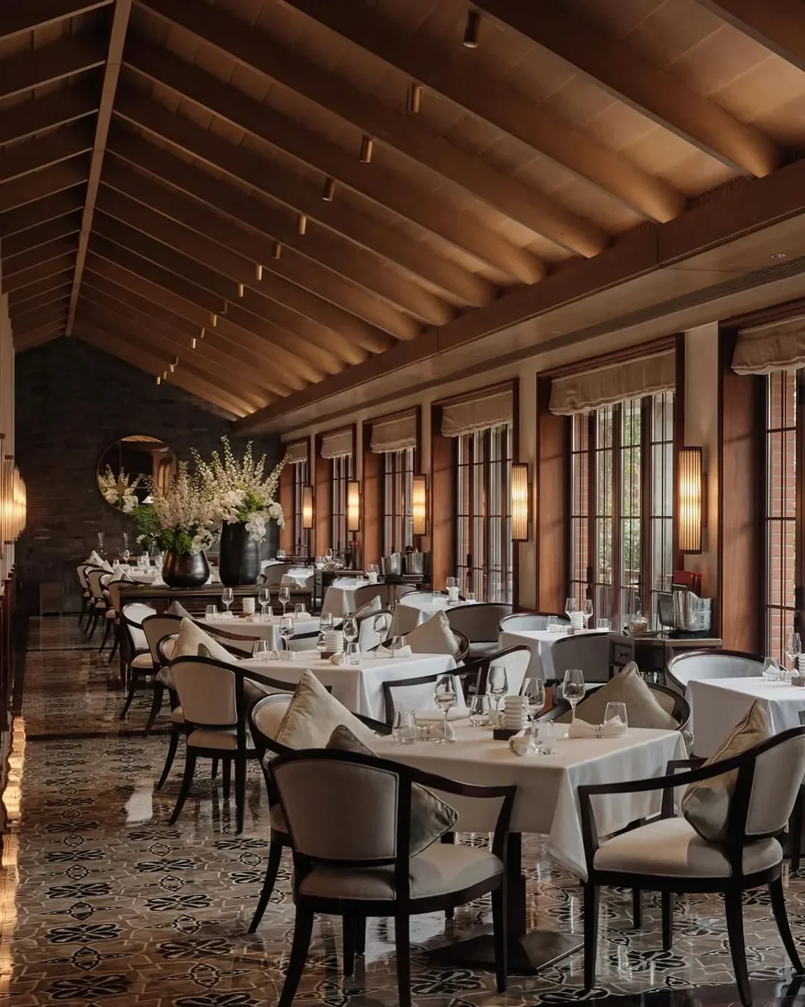 Elegant dining room interior at Goh restaurant in Fukuoka, with a warm and inviting atmosphere.