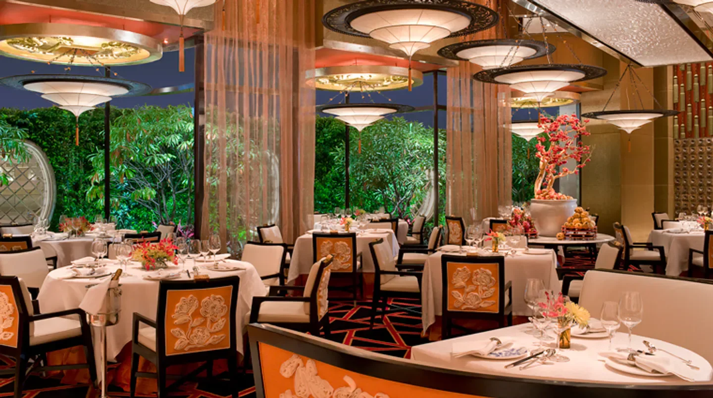 Elegant dining room at Golden Flower at Encore Macau, featuring floral decor and inviting ambiance