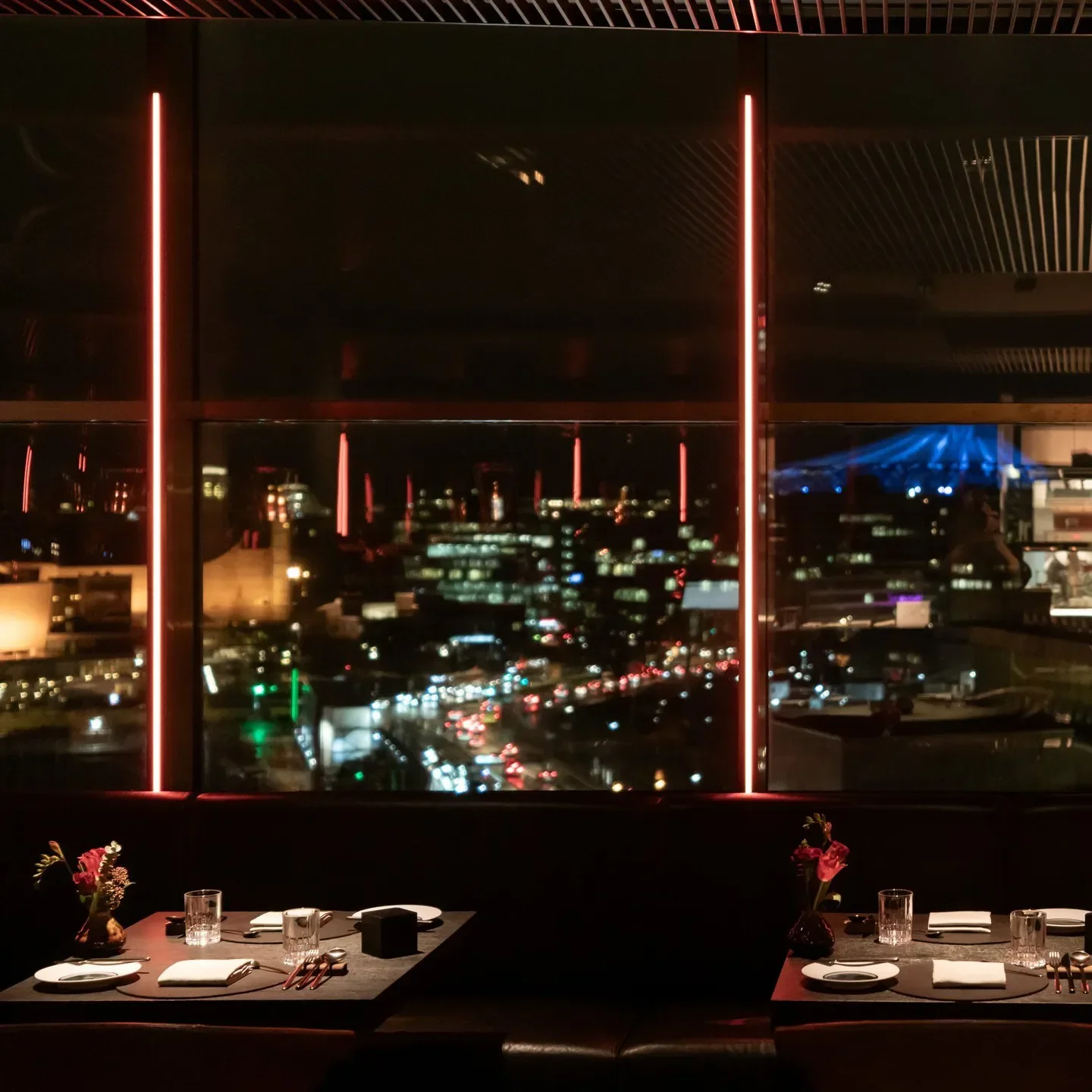 GOLVET restaurant in Berlin at night, with city views through the large window