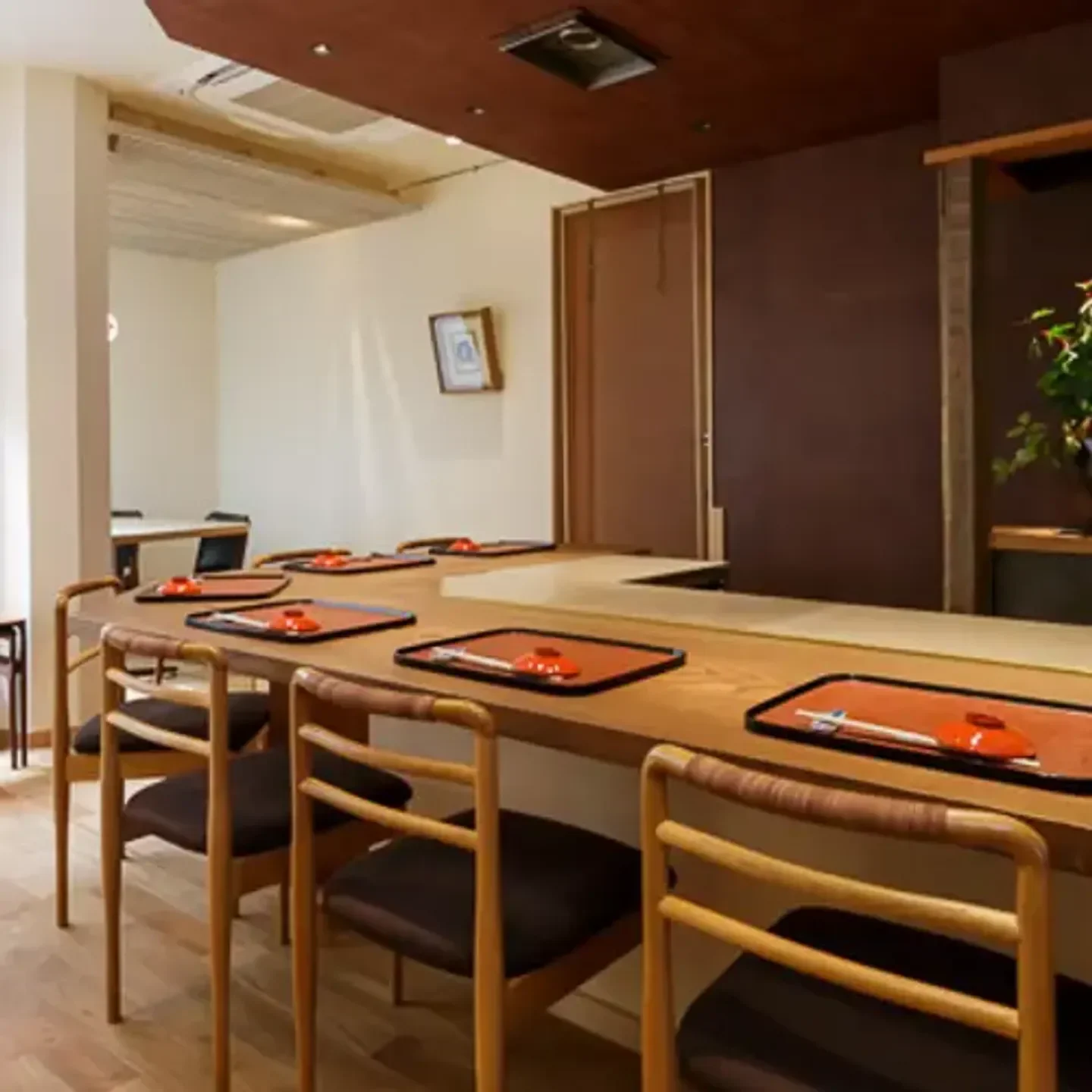 Interior dining space at Gosho Iwasaki in Kyoto with tables set for guests