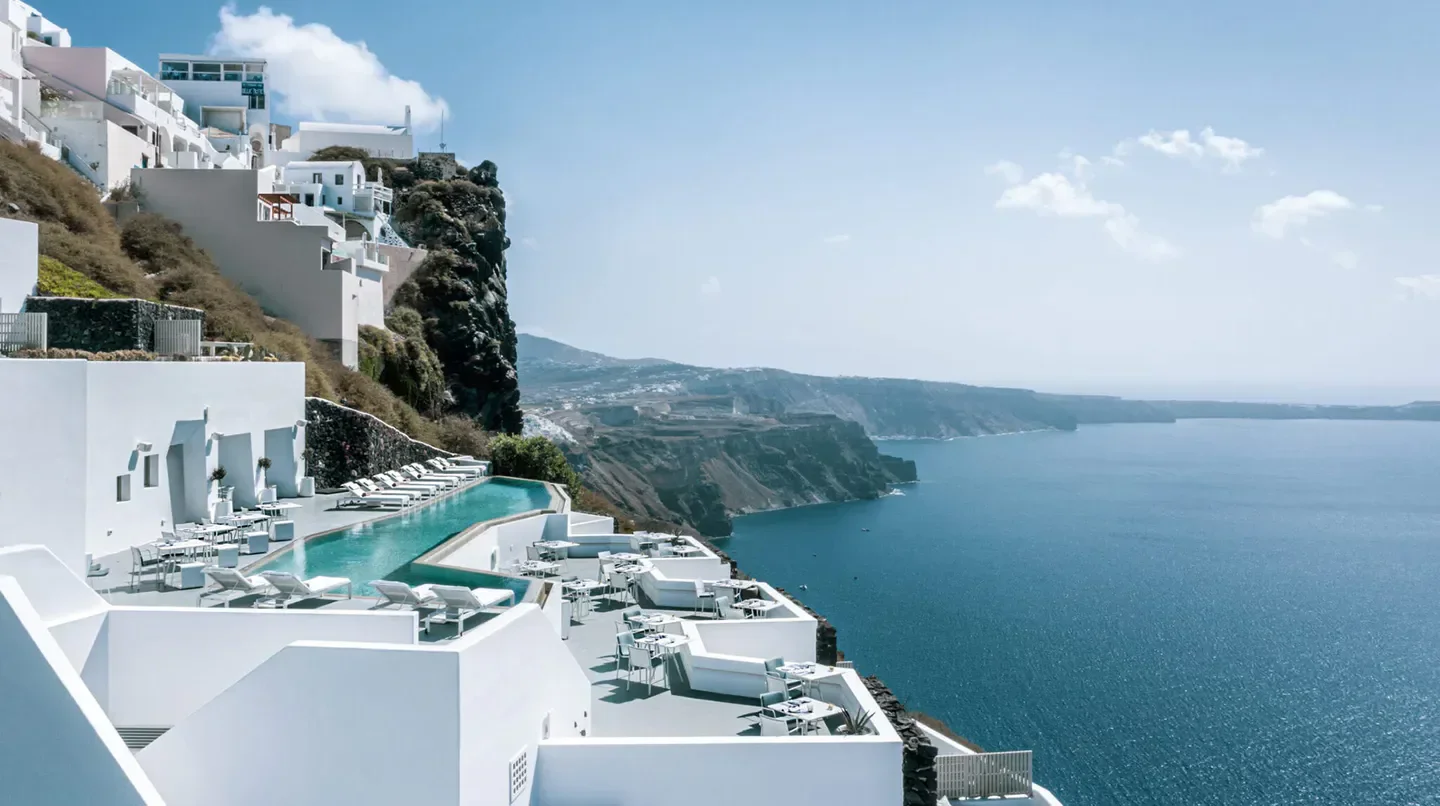 Grace Hotel Santorini with a stunning cliffside pool overlooking the Aegean Sea in Santorini.