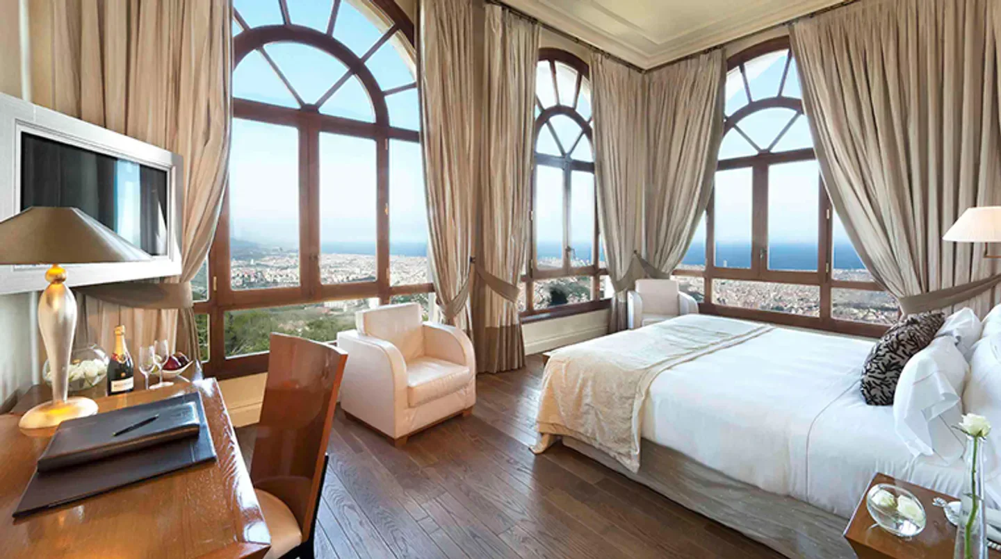 Elegant hotel room at Gran Hotel La Florida with panoramic views of Barcelona.
