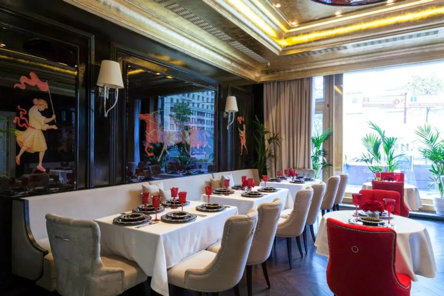 Elegant interior of Grand Cafe Dr. Jhivago in Moscow, with stylish decor and dining tables.