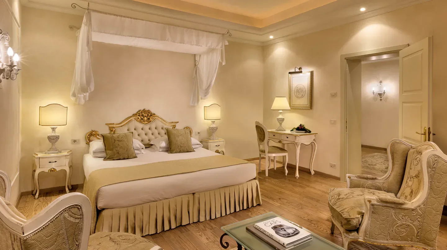 Elegant bedroom at Grand Hotel Fasano in Rome, featuring classic Italian design.