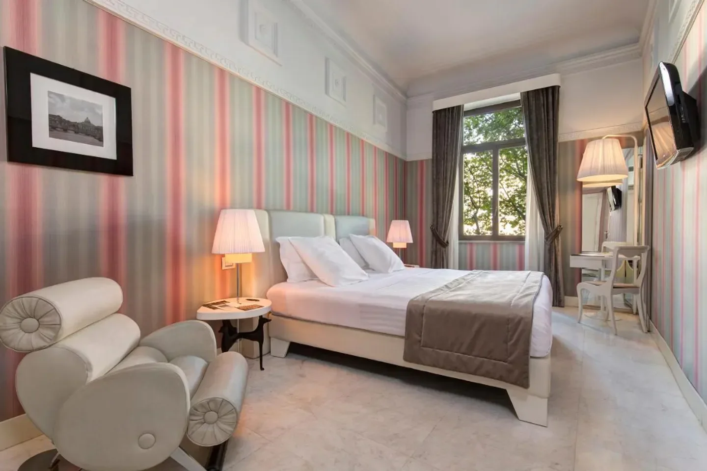 Cozy bedroom at Grand Hotel Victoria Concept & Spa in Rome, Italy, featuring elegant decor.