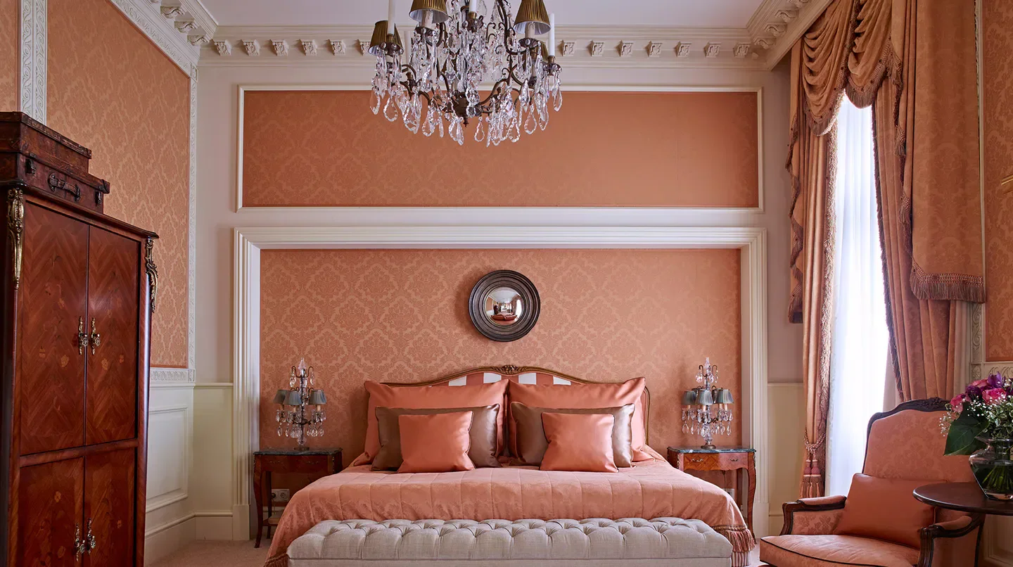 Elegant bedroom at the Grand Hotel Wien in Vienna featuring luxurious decor and design.