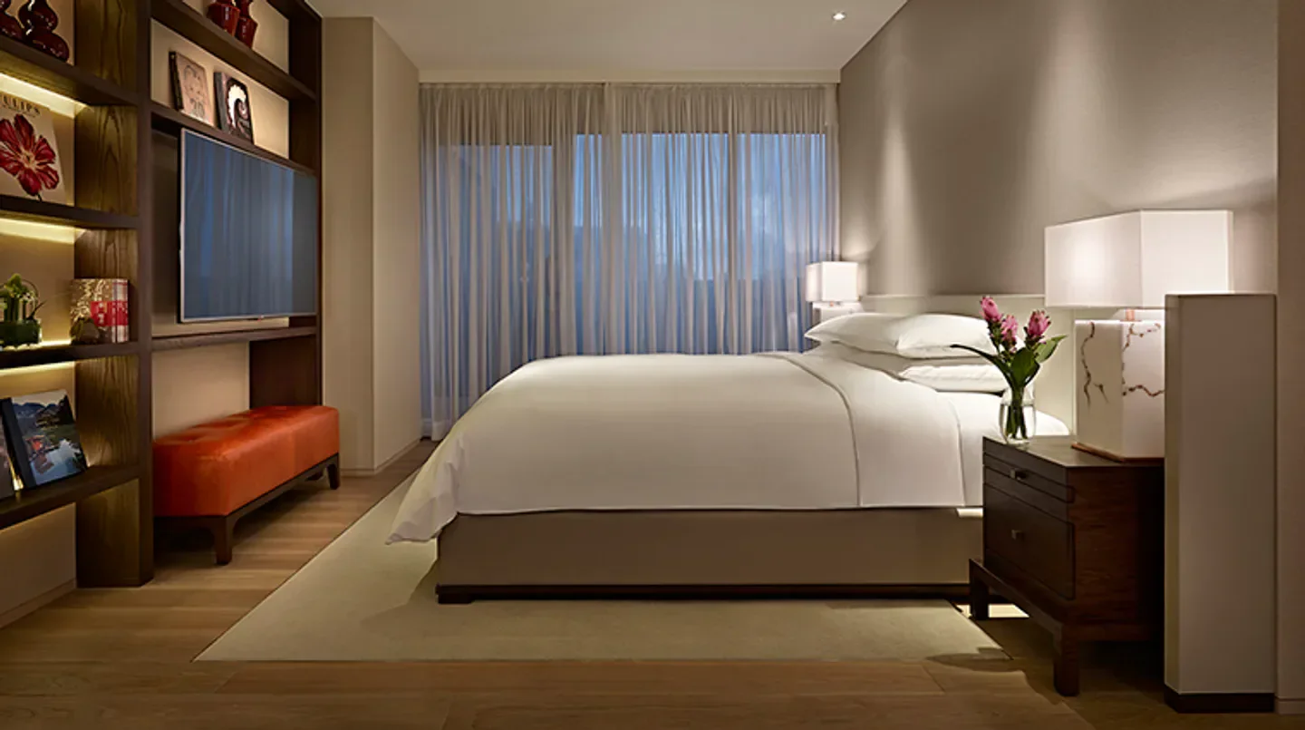 Cozy bedroom at Grand Hyatt Taipei, featuring a luxurious bed in Taipei.