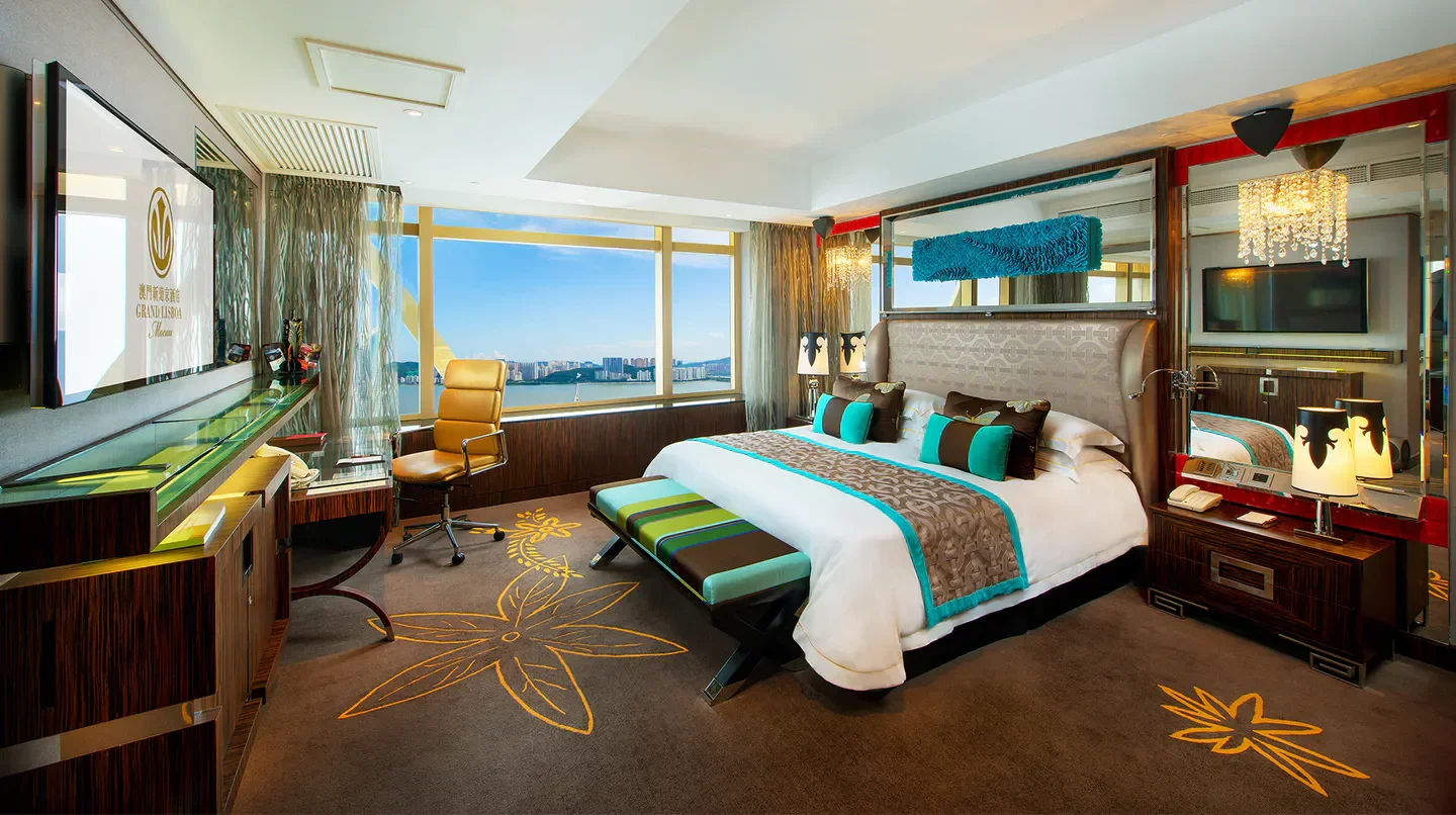 Luxury bedroom at Grand Lisboa Hotel in Macau with city views and elegant decor