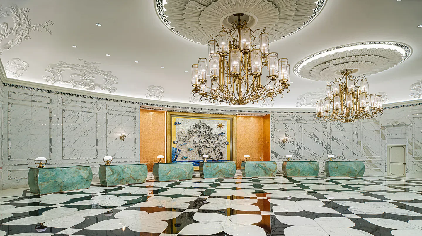 Grand Lisboa Palace Macau hotel lobby in Macau with chandeliers and ornate design.