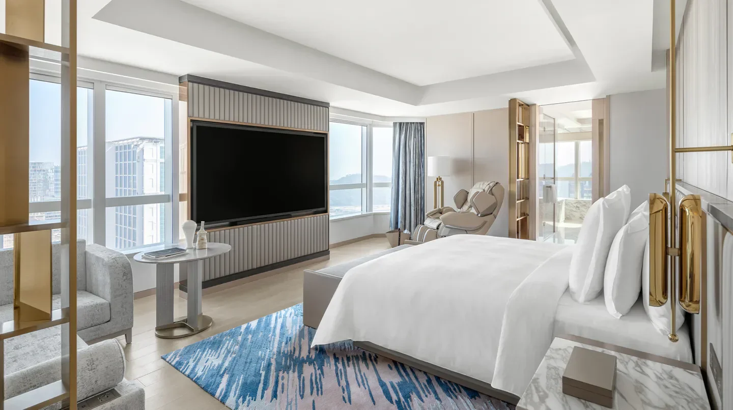 Luxury suite at Grand Suites at Four Seasons Hotel Macao, Cotai Strip, offering views of Macau.