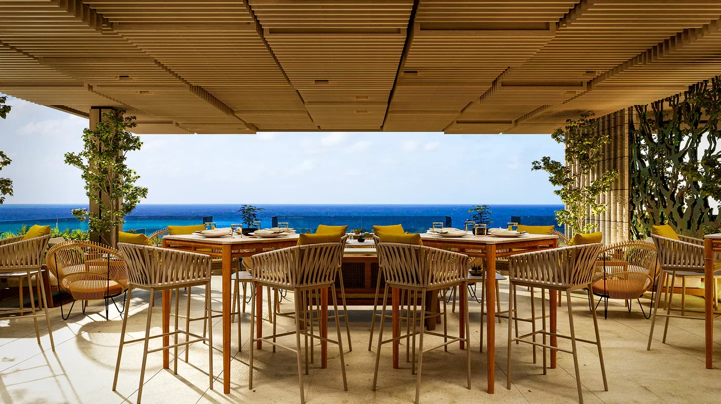 Outdoor dining at Grand Velas Boutique Hotel in Cabo San Lucas overlooking the ocean.