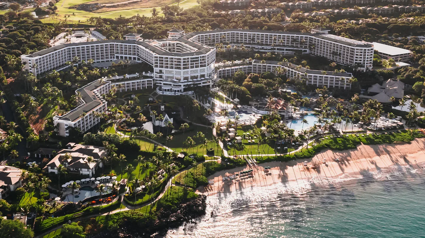 Aerial view of Grand Wailea Maui, A Waldorf Astoria Resort on the coast of Maui.