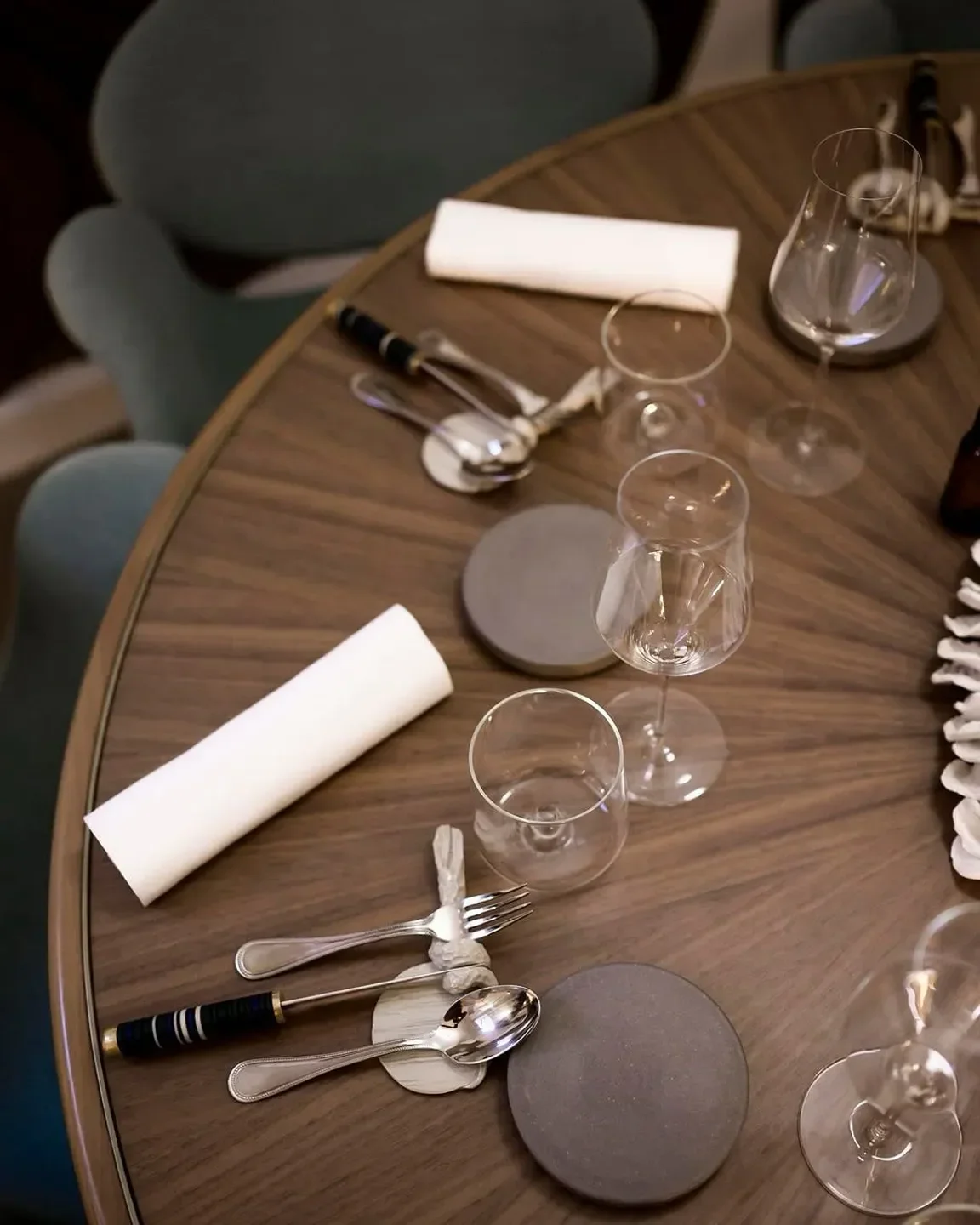 Table setting at Granite restaurant in Paris, featuring glasses and silverware elegantly arranged.