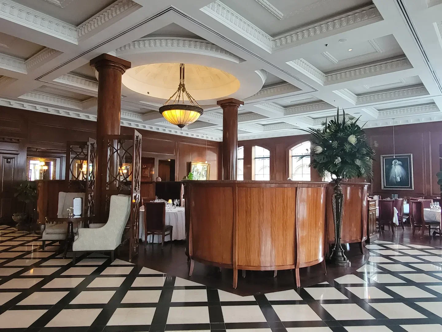 Elegant interior of Grill 225 restaurant in Charleston, featuring wooden accents and decor.
