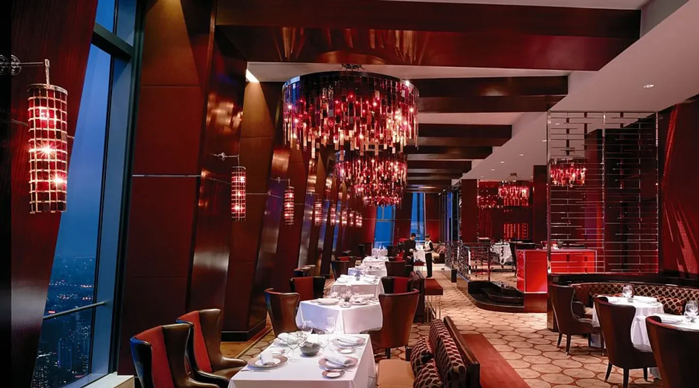 Elegant interior of Grill 79 restaurant in Beijing, featuring stylish chandeliers and dining tables