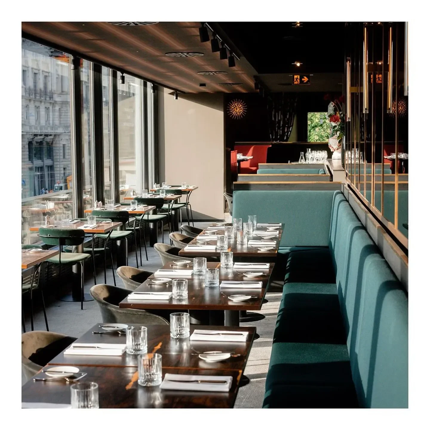 Interior of Grill im Künstlerhaus in Munich, featuring stylish seating and city views.