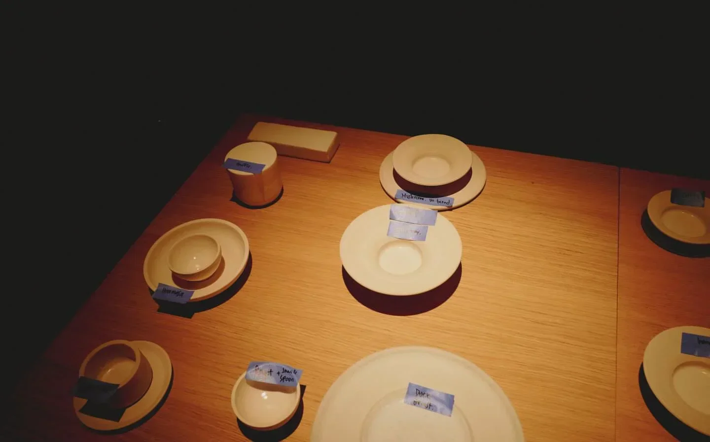 Table setting at Grön Helsinki restaurant, showcasing minimalistic dishware and culinary presentation.