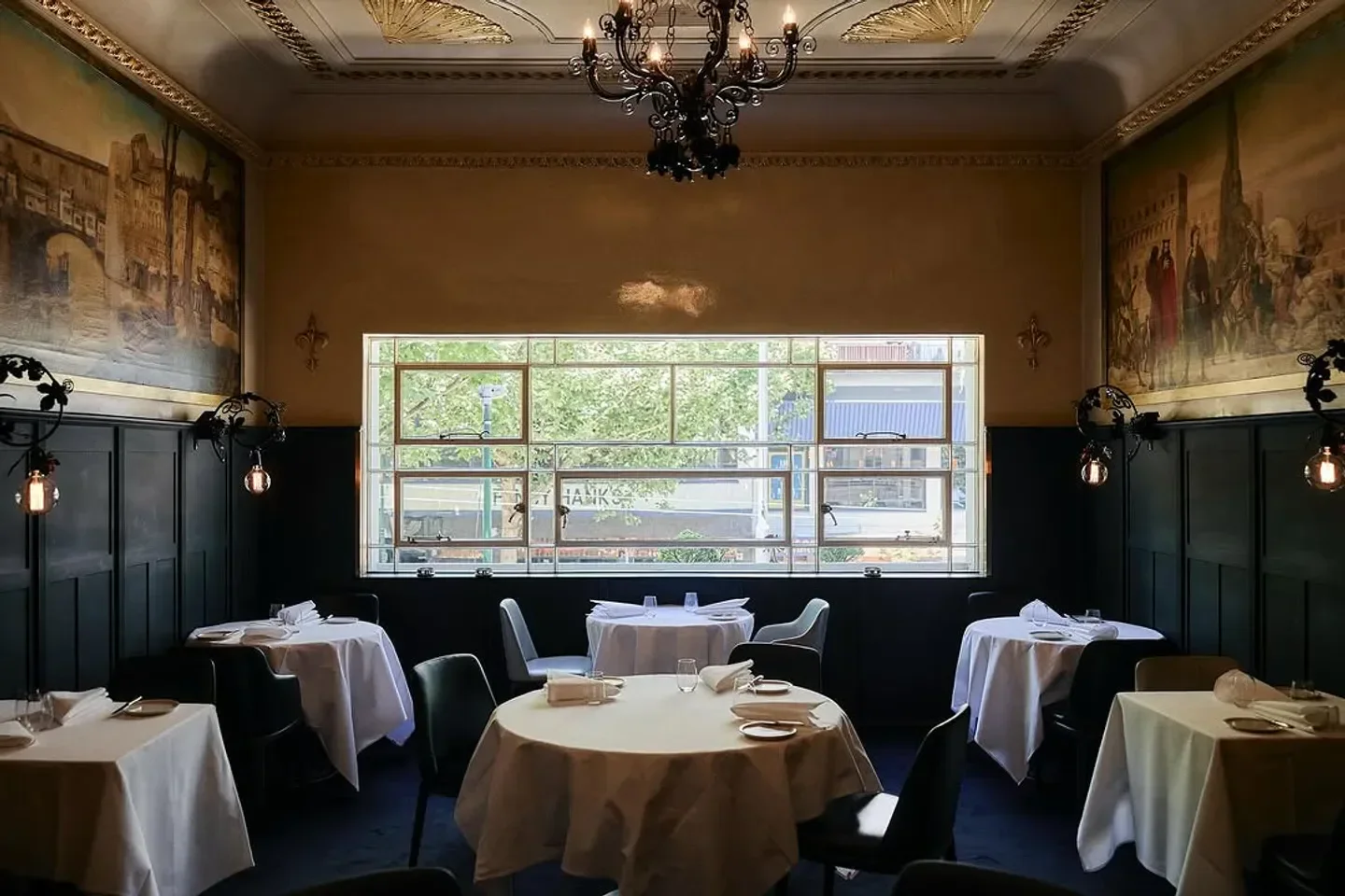 Elegant dining room at Grossi Florentino in Melbourne with tables set for service.