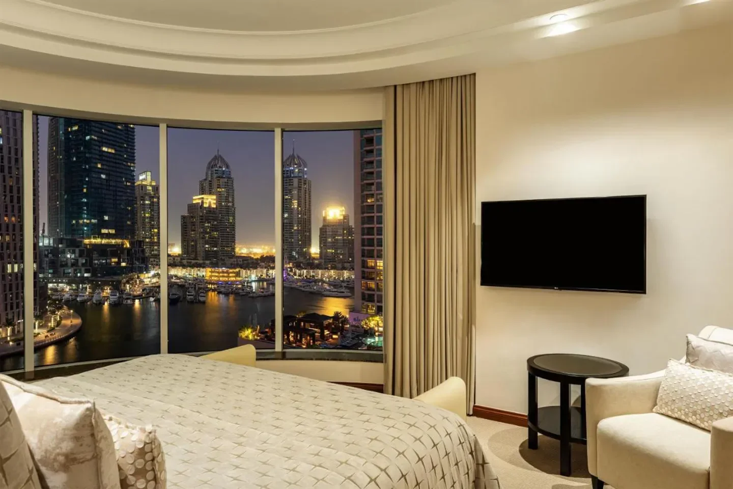 Bedroom view at Grosvenor House, A Luxury Collection Hotel, Dubai overlooking city lights.