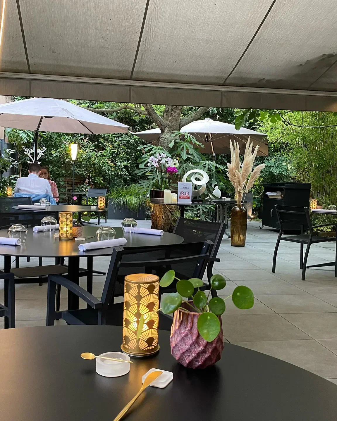 Outdoor dining at Guillaume Scheer - Les Plaisirs Gourmands in Strasbourg, with stylish decor.