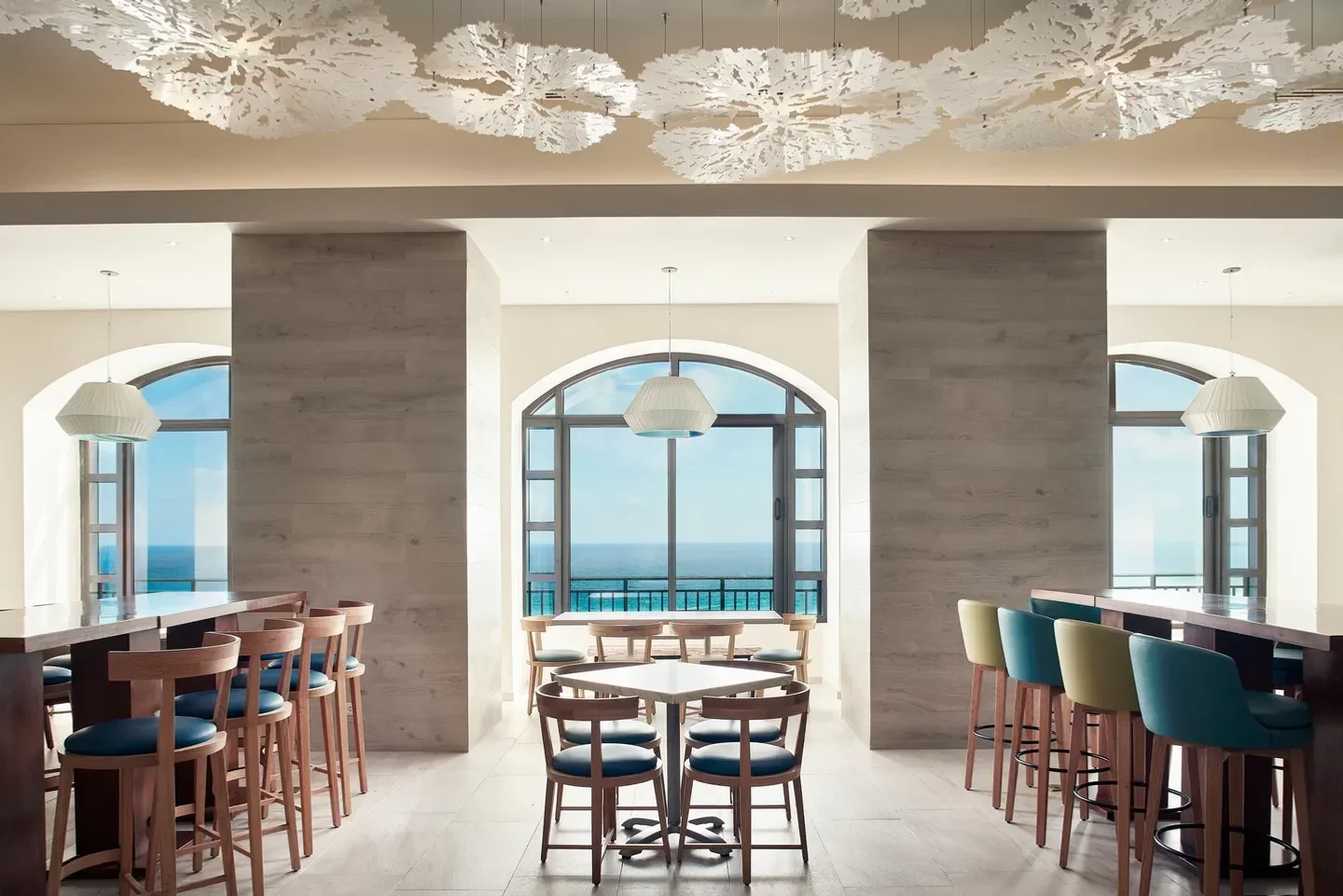 Interior view of Gustino restaurant in Cancun with ocean views and stylish decor.