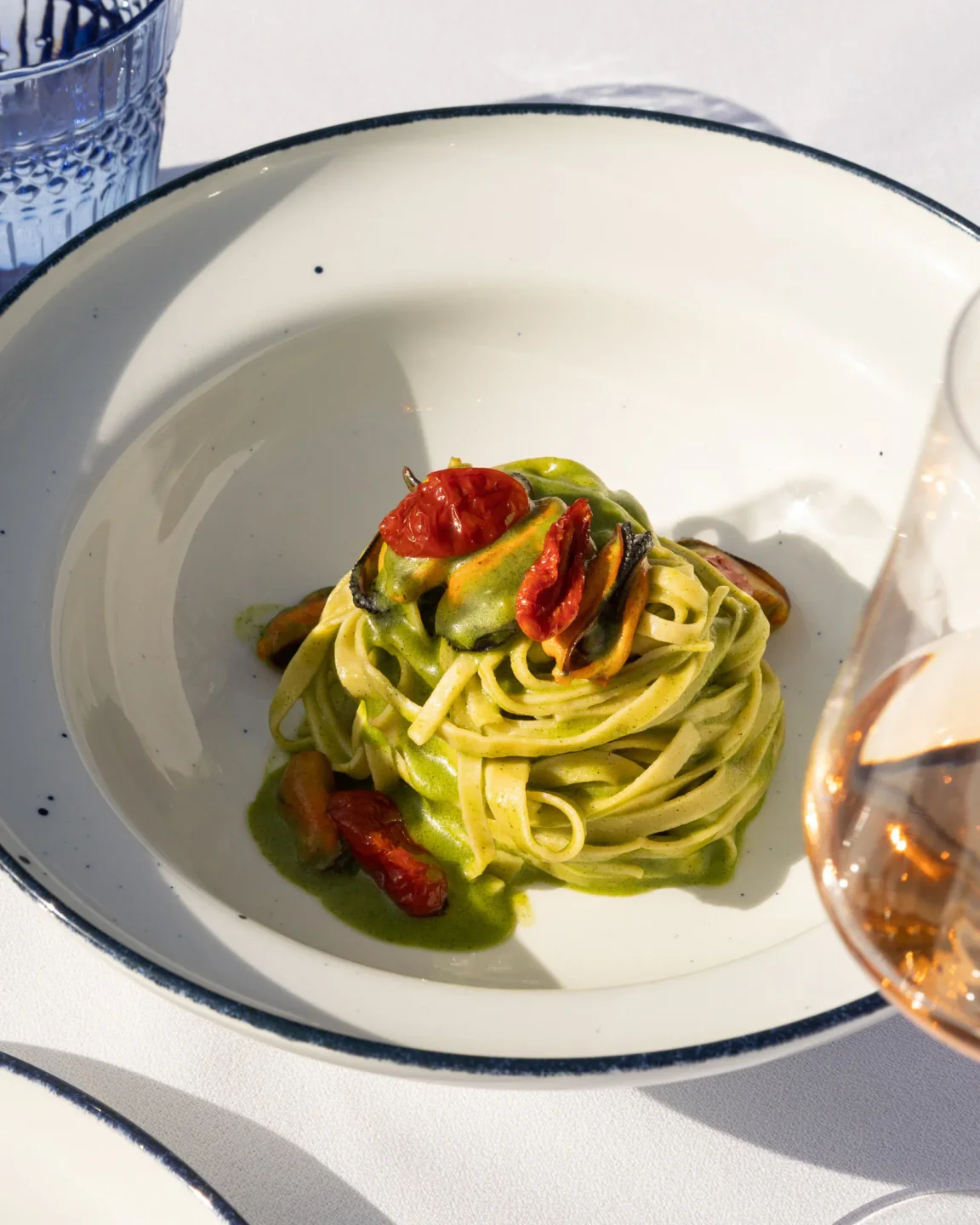 A vibrant plate of tagliatelle pasta with mussels and sun-dried tomatoes at Gusto by Sadler in the city.