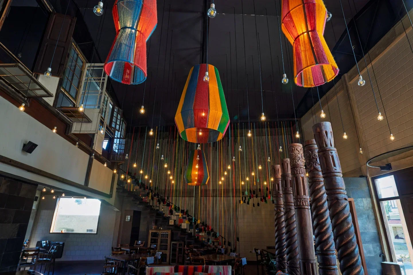Colorful decor inside Gustu restaurant in La Paz, featuring unique hanging lights.