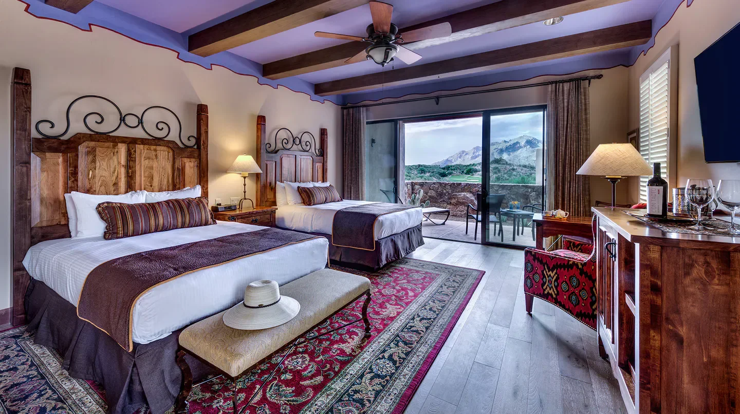 Cozy bedroom at Hacienda Del Sol Guest Ranch Resort in Tucson with mountain views