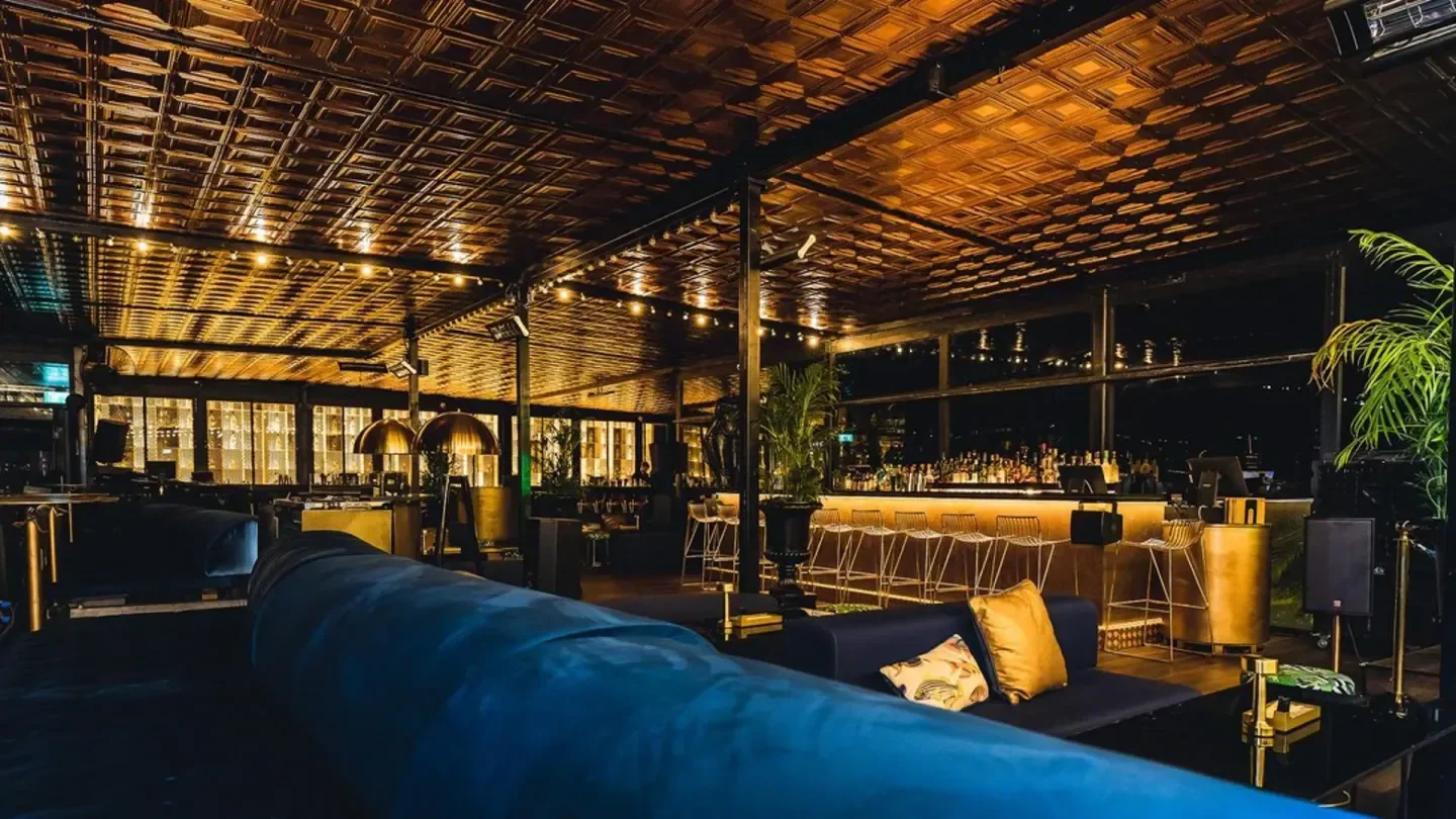 Interior of Haiku Skybar in Tel Aviv, with bar and comfortable seating area.