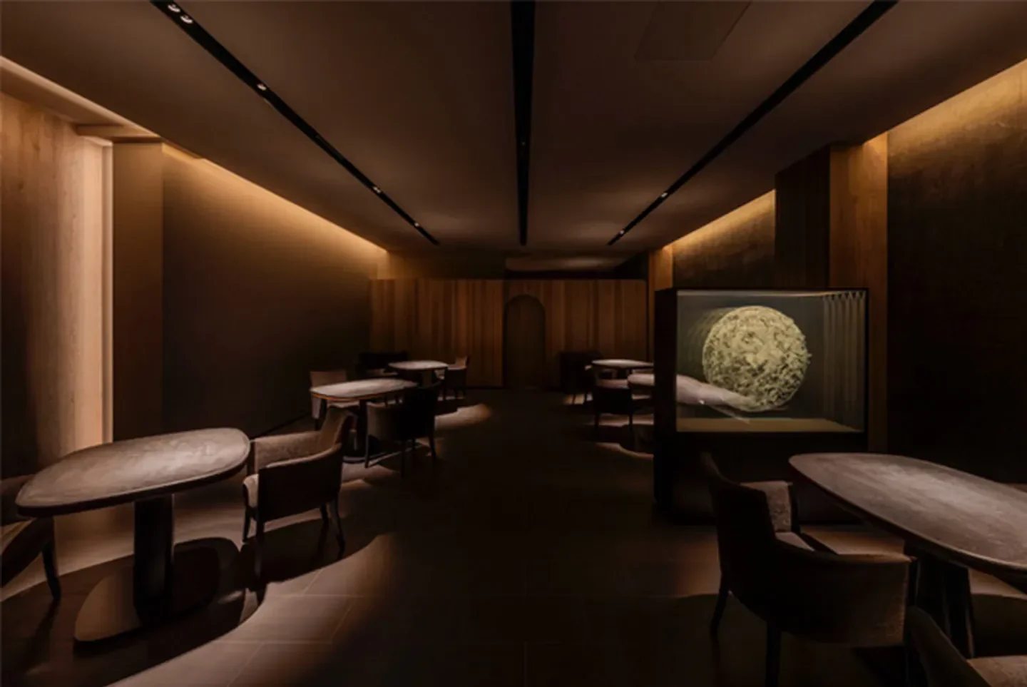 Interior of Hajime restaurant in Osaka, Japan, featuring elegant lighting and tables.