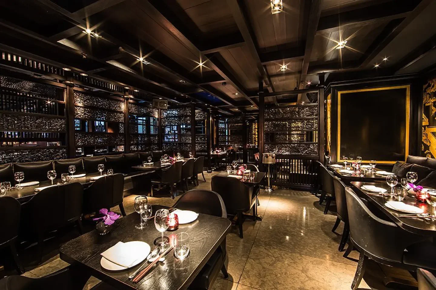 Hakkasan Abu Dhabi's elegant dining room with stylish decor and intimate setting