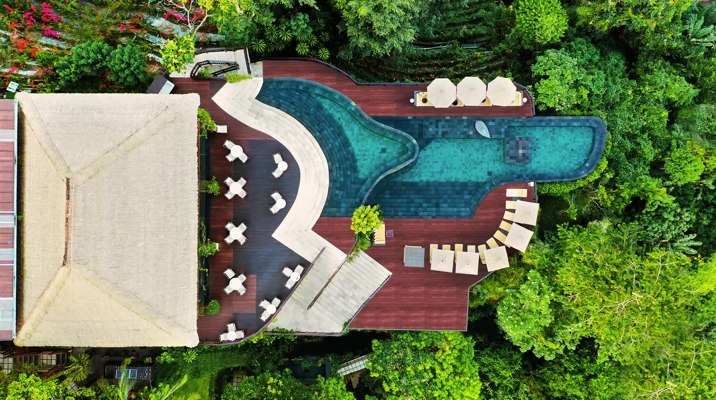 Aerial view of Hanging Gardens of Bali resort with pool in lush tropical setting