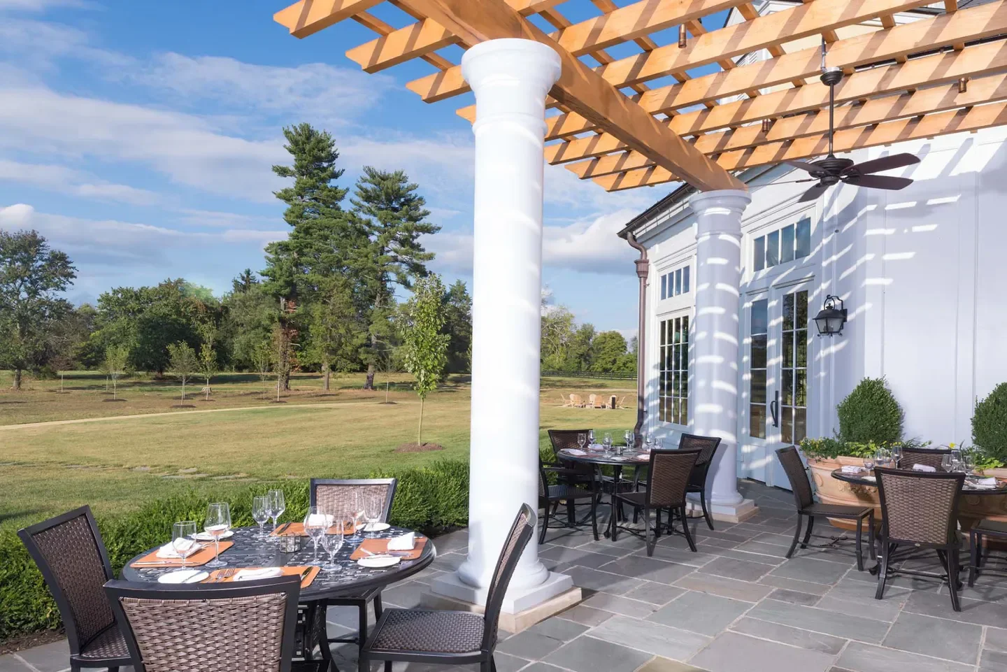 Outdoor patio dining at Harrimans Grill in Virginia Beach with a beautiful view.