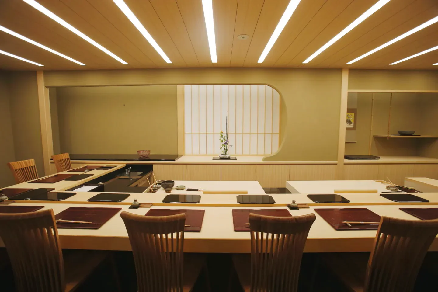 Elegant dining space at Harutaka restaurant in Tokyo, featuring traditional Japanese decor.