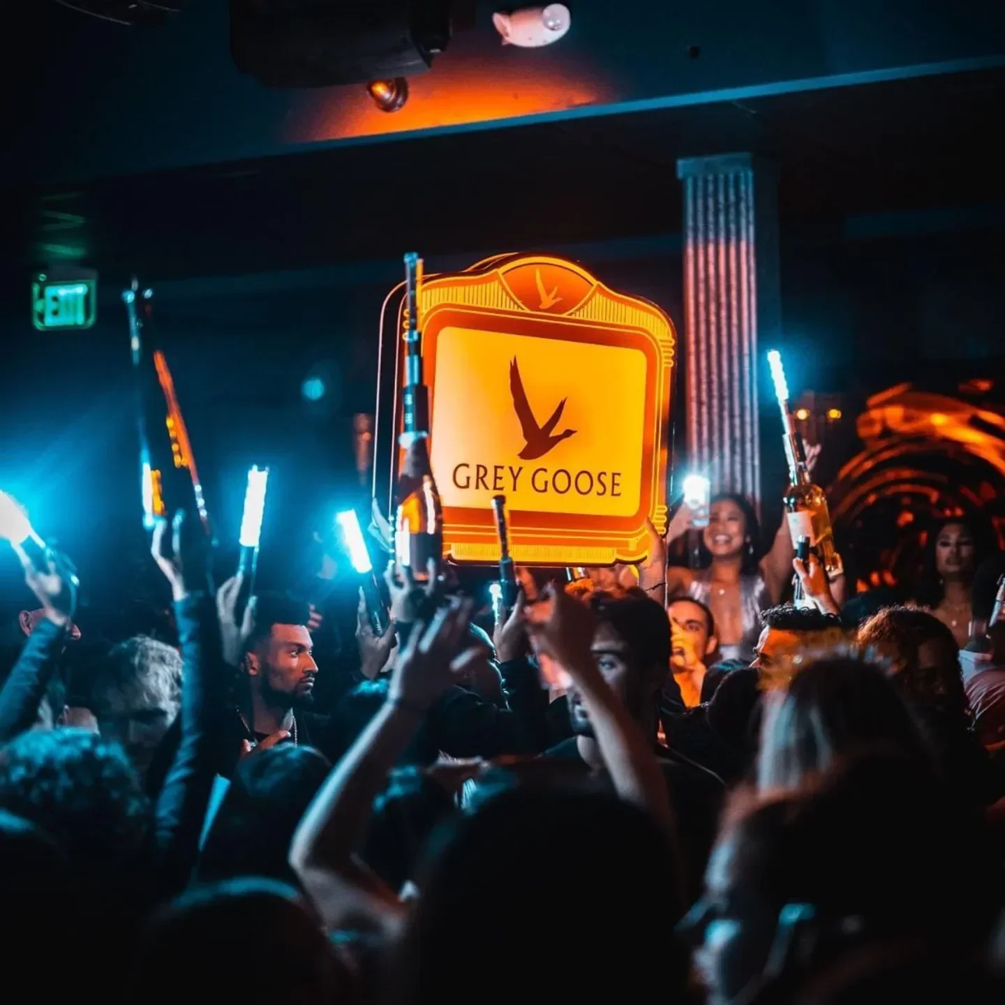 Energetic crowd celebrating at Hava nightclub in Boston with Grey Goose bottles.