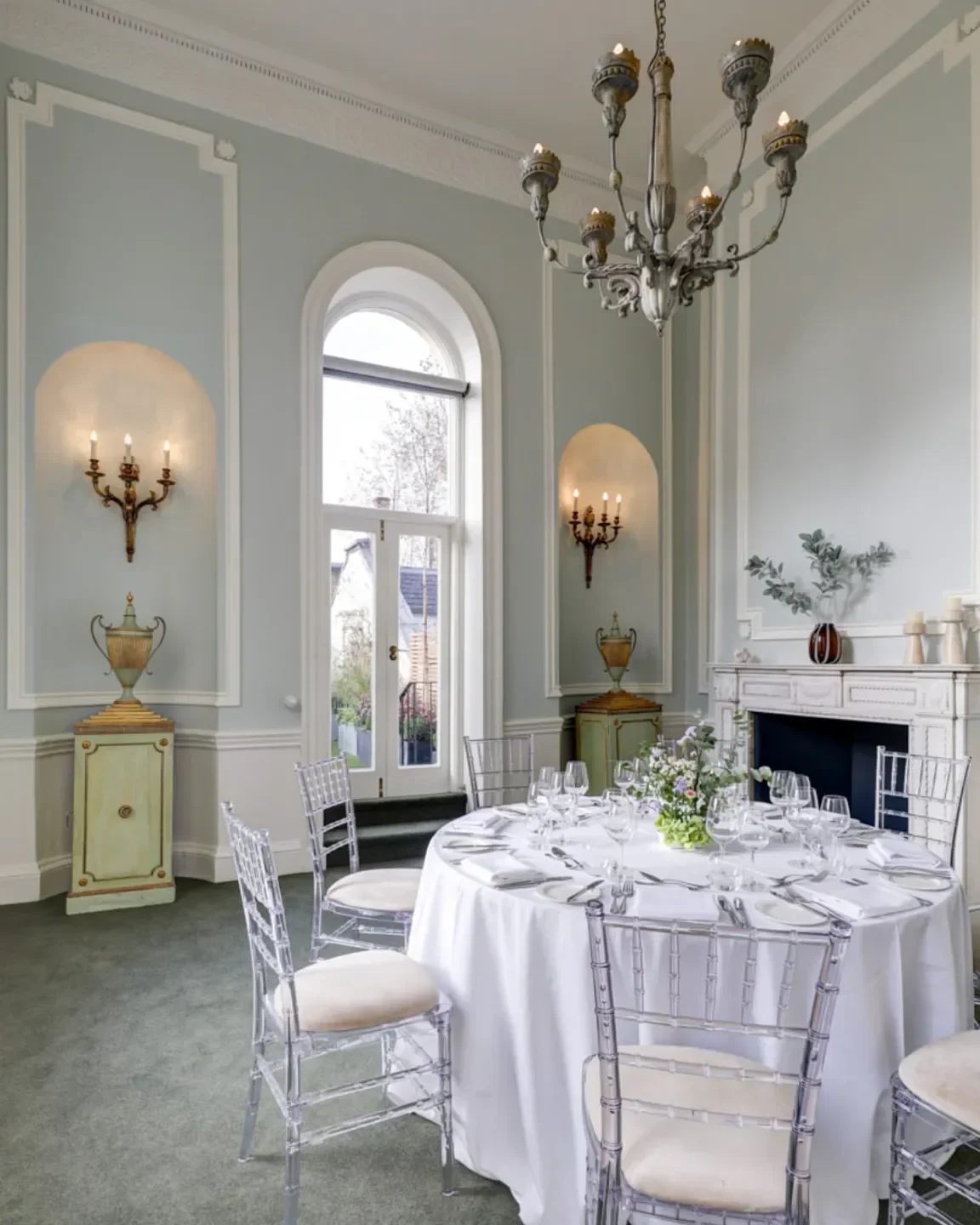 Elegant dining room interior at Helix by Searcys in London, featuring a round table setting.