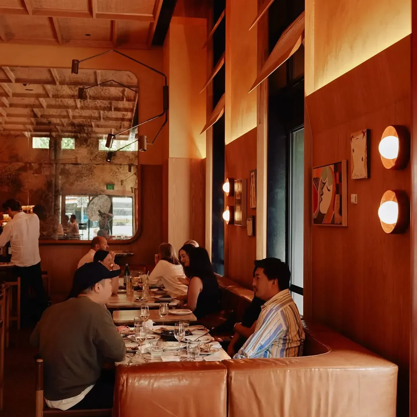 Interior dining at HER Rooftop restaurant in Melbourne, with tables and guests