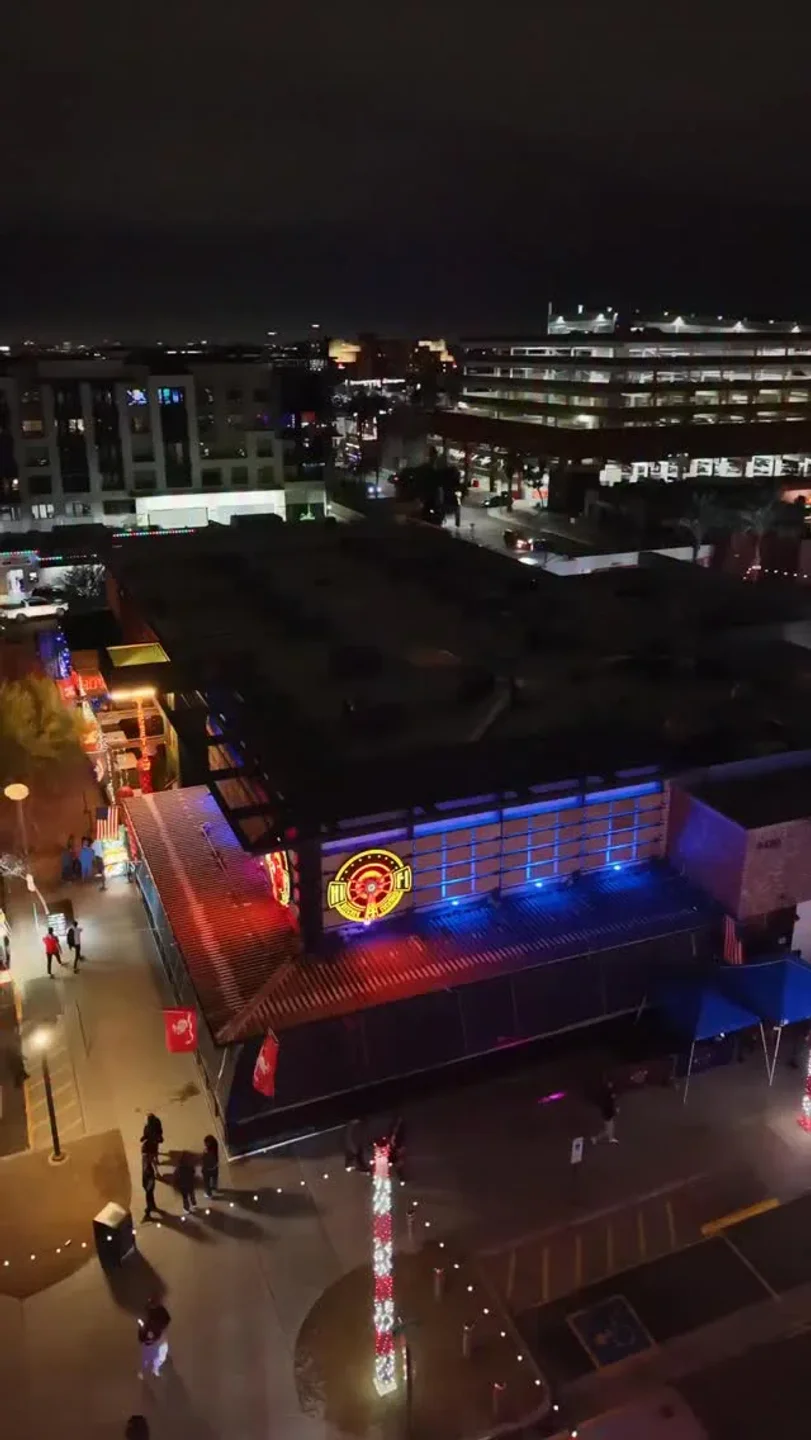 Exterior view of HiFi nightclub in Scottsdale, Arizona, at night. Neon lights and exterior architecture.