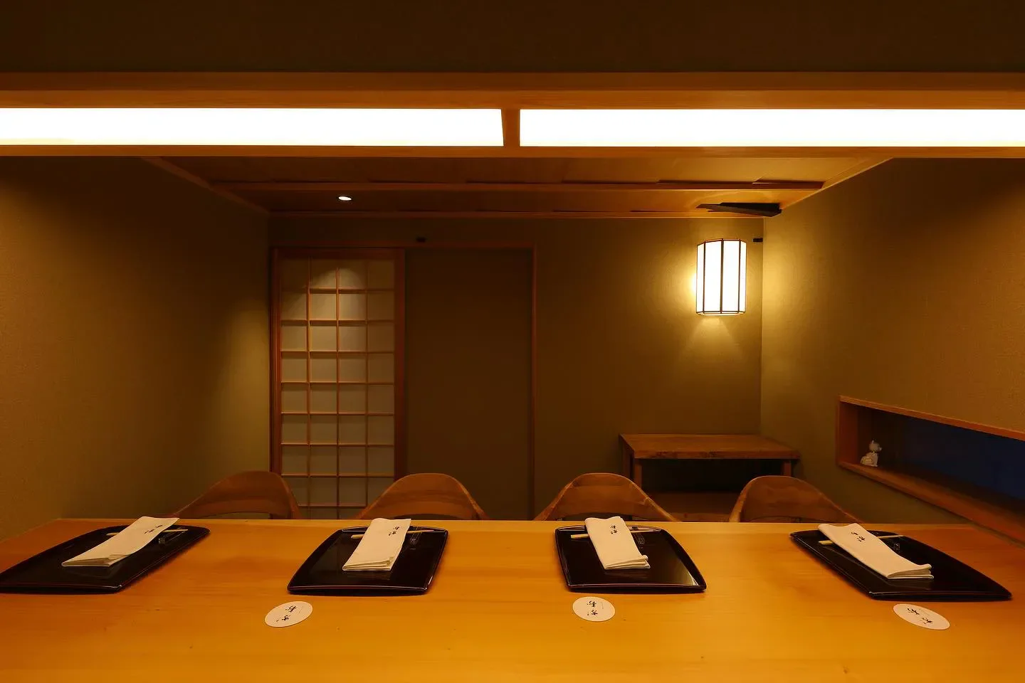 Interior dining space at Higashiyama Yoshihisa restaurant in Kyoto, featuring wooden tables and details