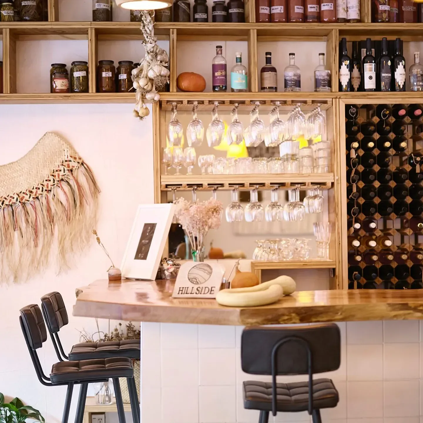 Interior of Hillside restaurant in Wellington featuring bar, decor, and seating.