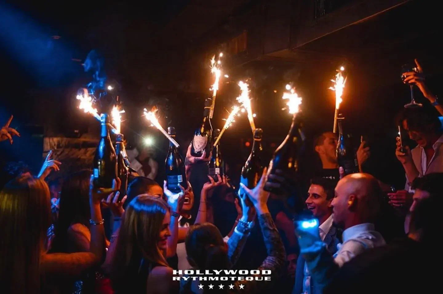 Celebration at Hollywood Rythmoteque in Milan with sparklers on champagne bottles