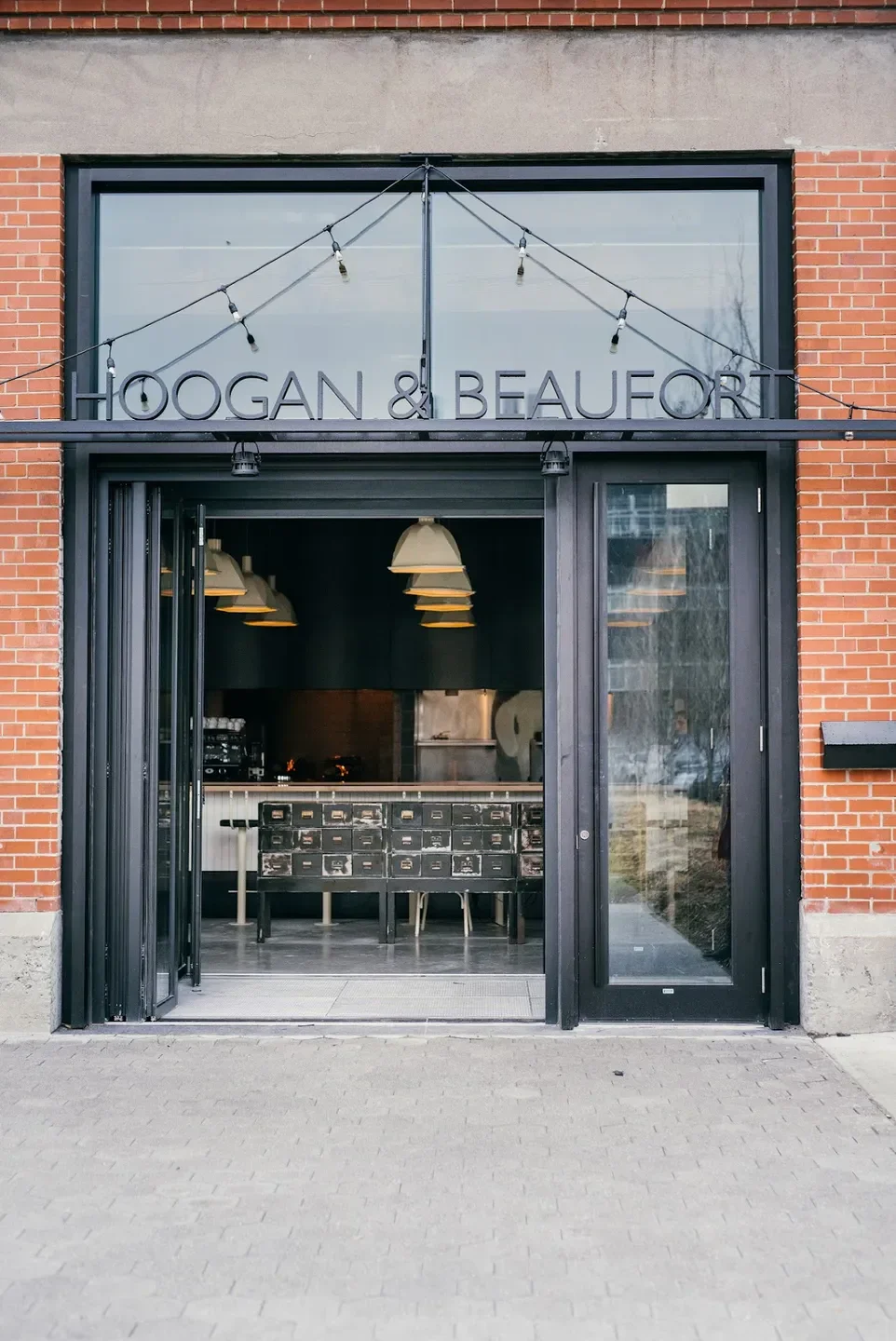 Entrance of Hoogan et Beaufort restaurant in Montreal, with industrial design