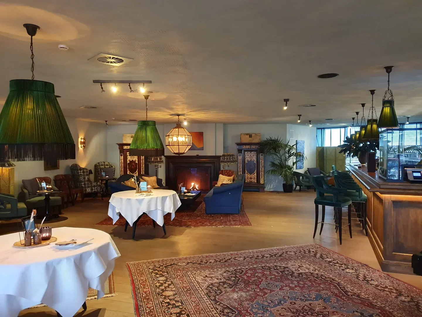 Elegant interior of Horseele restaurant in Ghent with fireplace and stylish decor