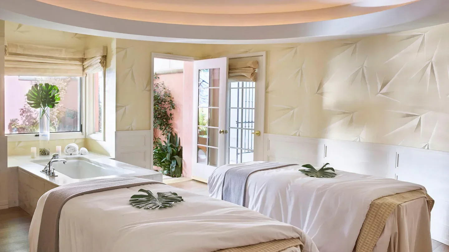 Hotel Bel-Air Spa in Los Angeles, serene spa treatment room with massage beds.