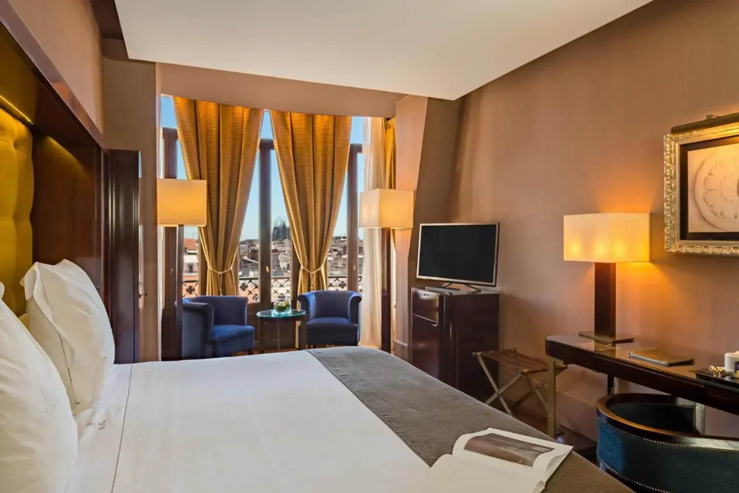 Cozy hotel room at Hotel Casa Fuster in Barcelona with city views and elegant decor