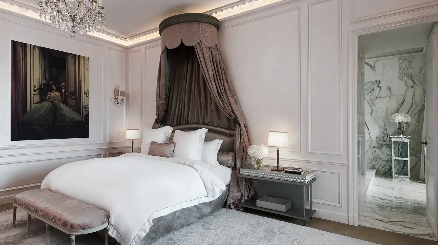 Elegant bedroom at Hôtel de Crillon, A Rosewood Hotel, Paris, featuring luxurious decor.