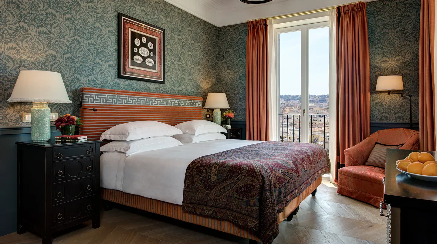 Cozy bedroom at Hotel de la Ville, a Rocco Forte Hotel in Rome, with city view