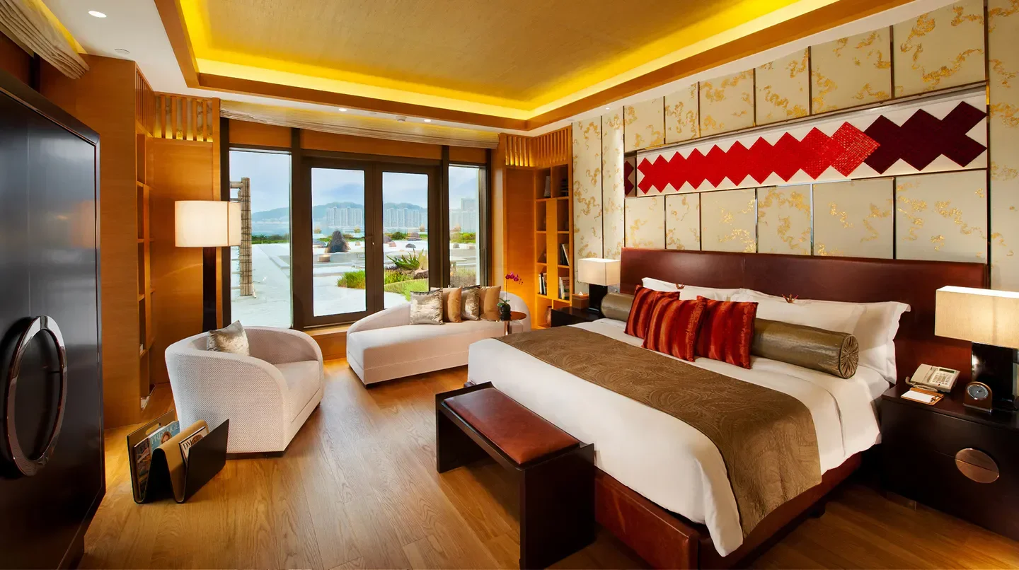Luxury bedroom at Hotel Okura Macau with city view in Macau.