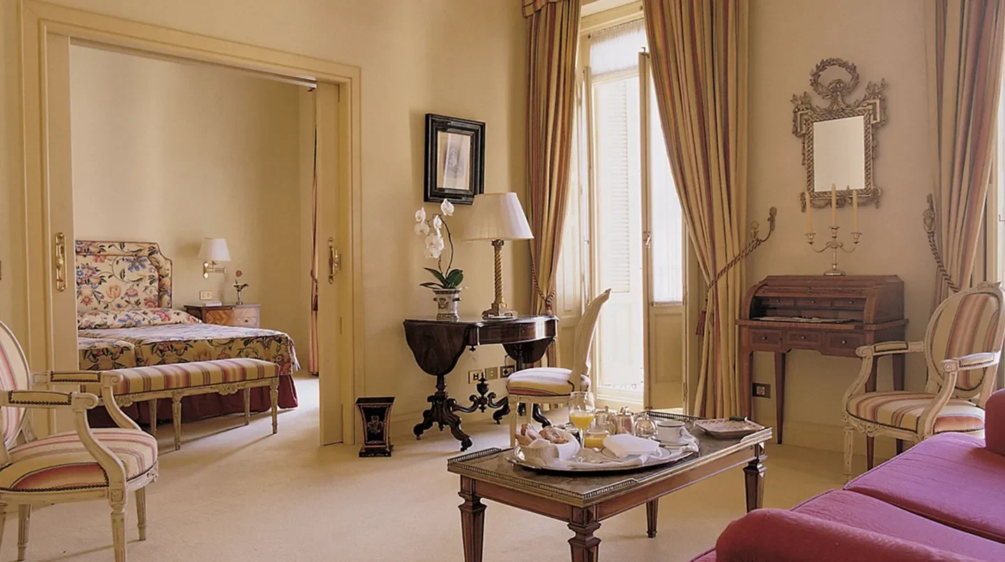 Elegant suite interior at Hotel Orfila, Madrid, with classic furnishings and breakfast tray